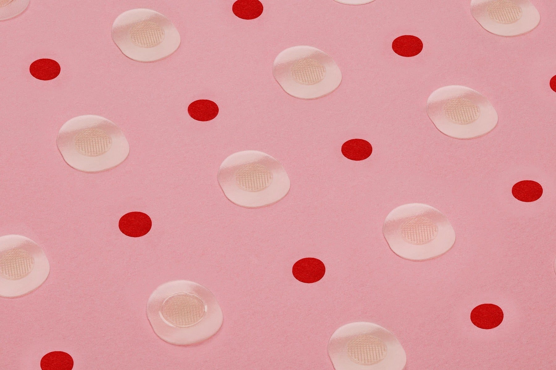 Bye Bye Blemish microneedling patches arranged with red dots on a pink surface.