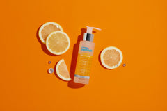 Vitamin C Exfoliating Gel with lemon slices for a brighter complexion and skin care. 