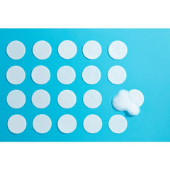 Bye Bye Blemish dissolving face cleanser pads arranged on blue background. Water-activated foaming formula for clear skin.