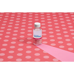 Bye Bye Blemish Drying Lotion on Pink Dots – Acne treatment bottle displayed on a pink polka dot background for skincare aesthetics.